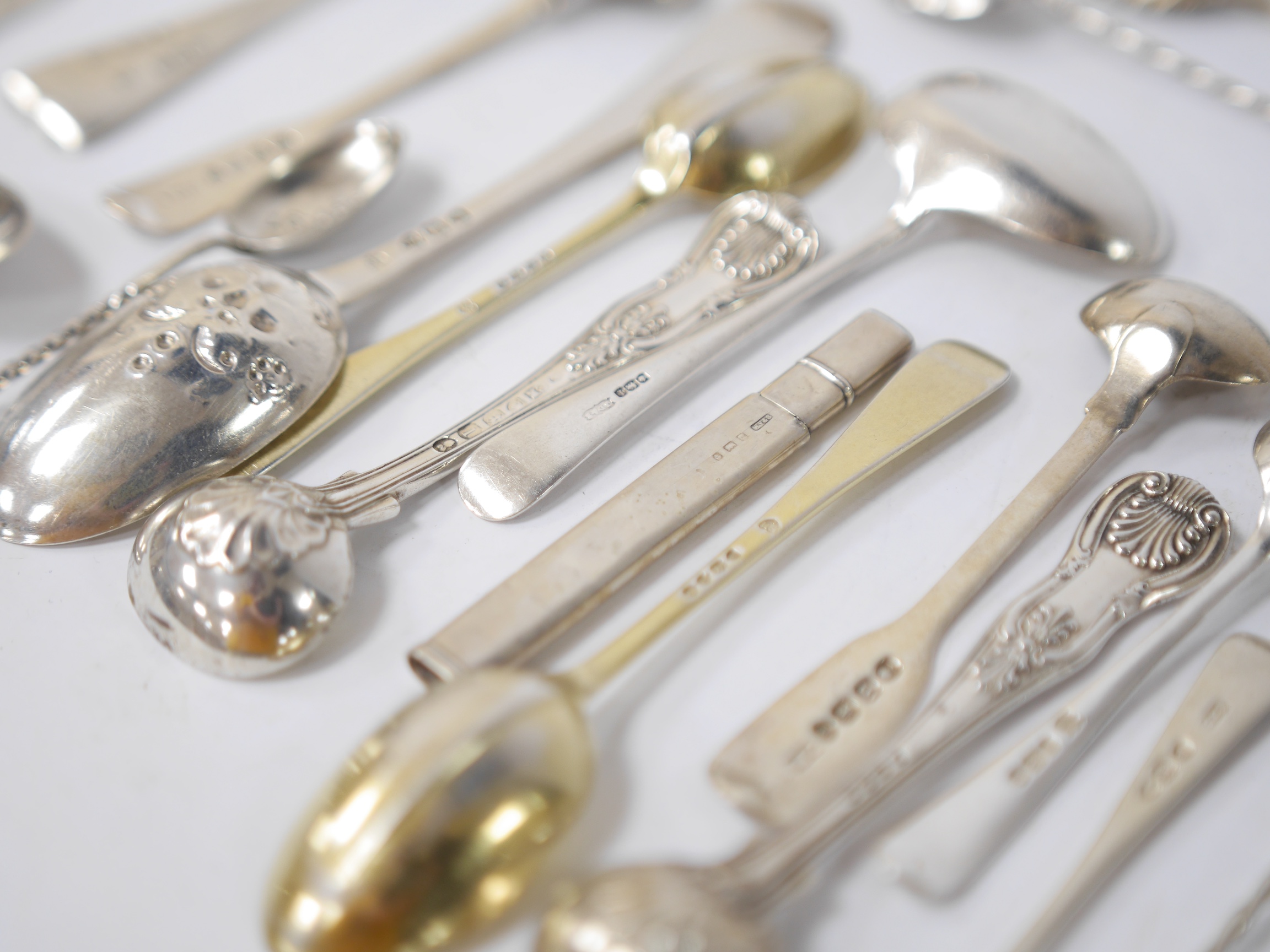 A quantity of assorted mainly 19th century and later silver flatware, including two Queens pattern sauce ladles, seventeen teaspoons, six mustard ladles, a toddy ladle, etc, and a silver pencil holder, various dates and